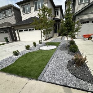 Decorative limestone rock used around a garden bed in Edmonton by Radiant Landscape